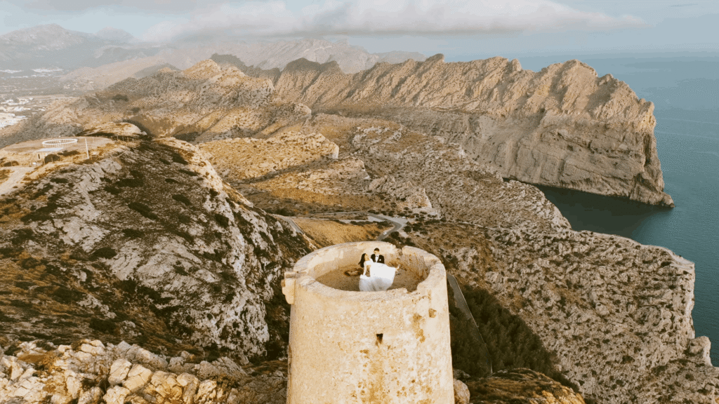 Naomi & Declan on a coastal stone tower in Mallorca – additional video session for their Kilronan Castle wedding film